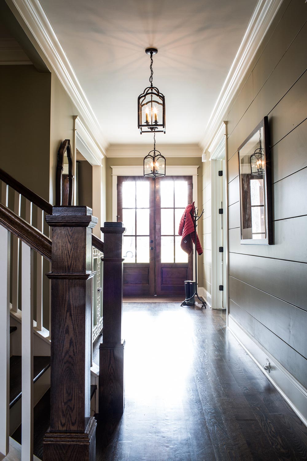 Dark wood entry floors and matching staircase. 