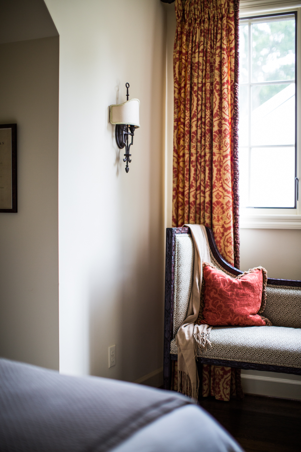 Cozy corner. Statement curtains. Pops of red. 